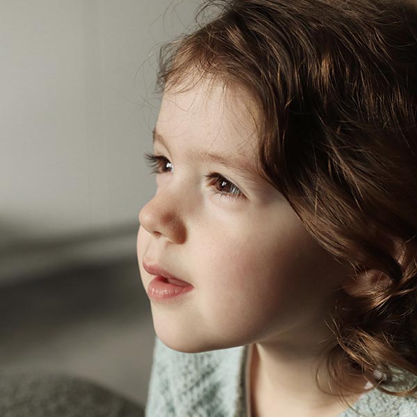 Child portrait, toddler looking to the right, side profile